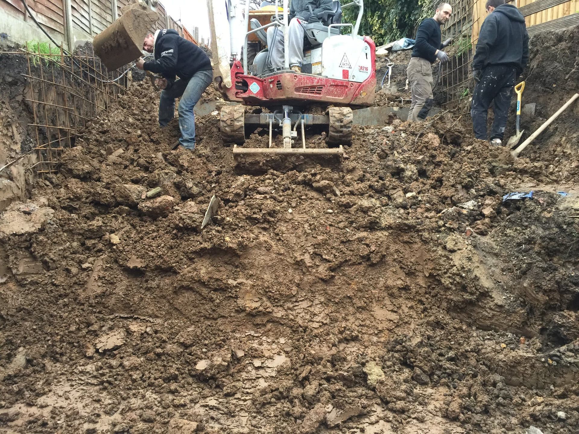 Excavation and reinforced retaining wall under construction for the lower-ground extension