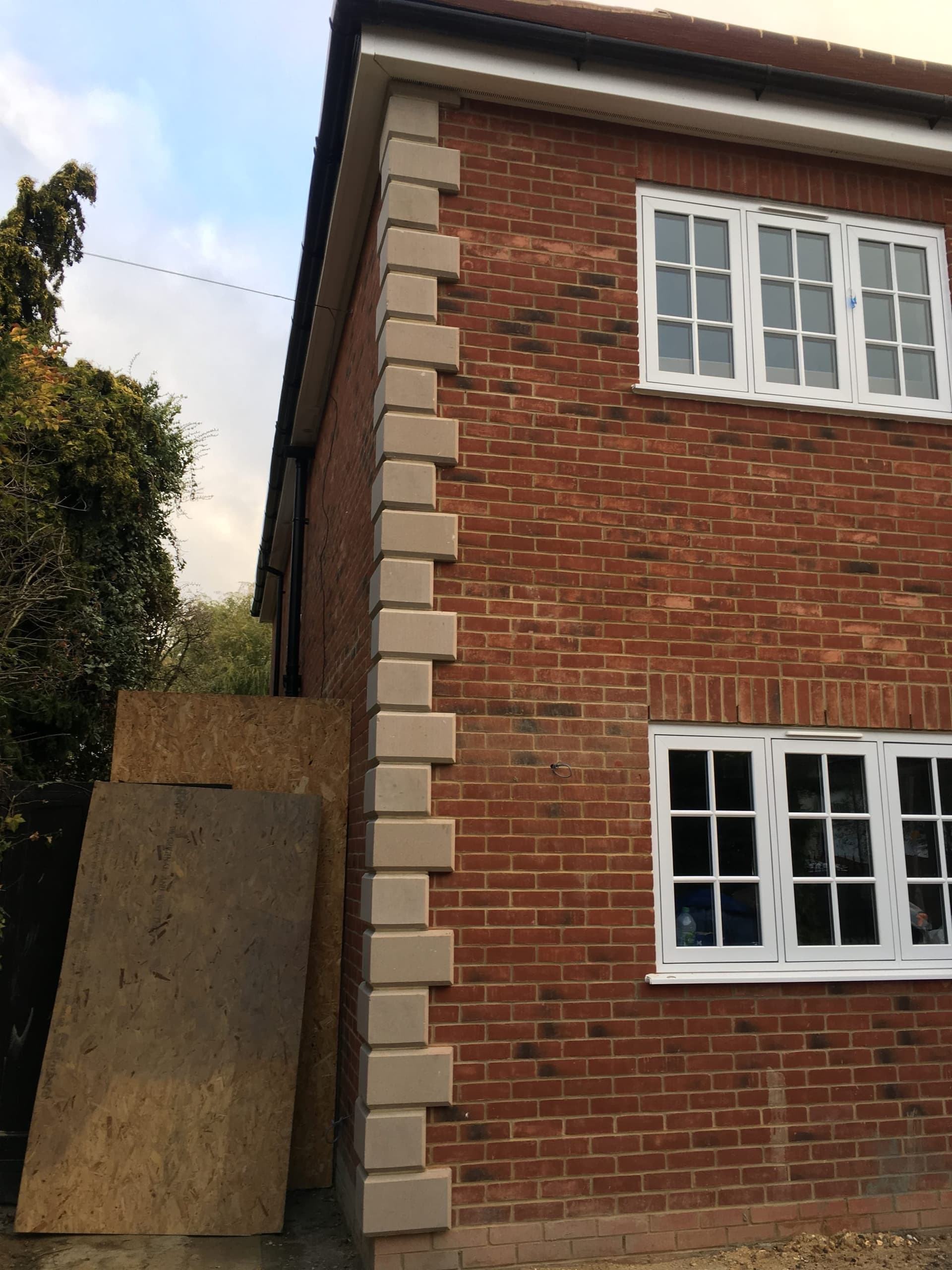 Close-up of the brickwork and roof eaves detail on a new-build house