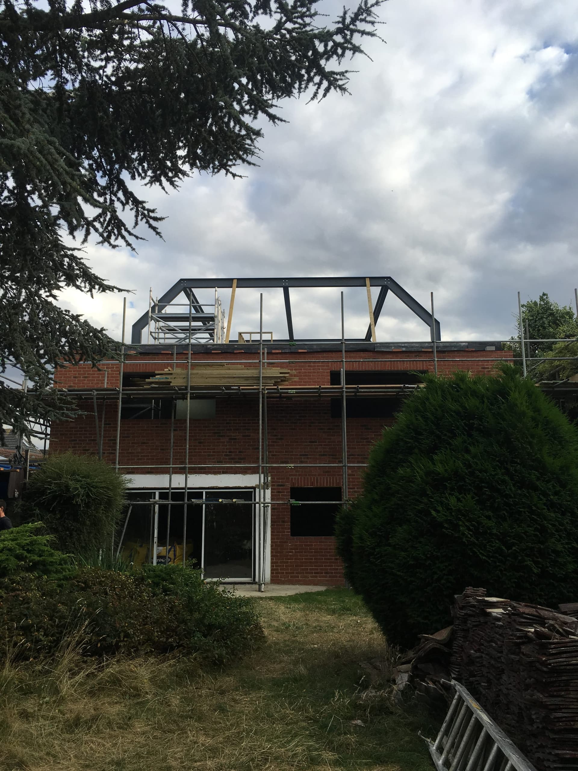Steel canopy frame being erected during construction of a new-build house