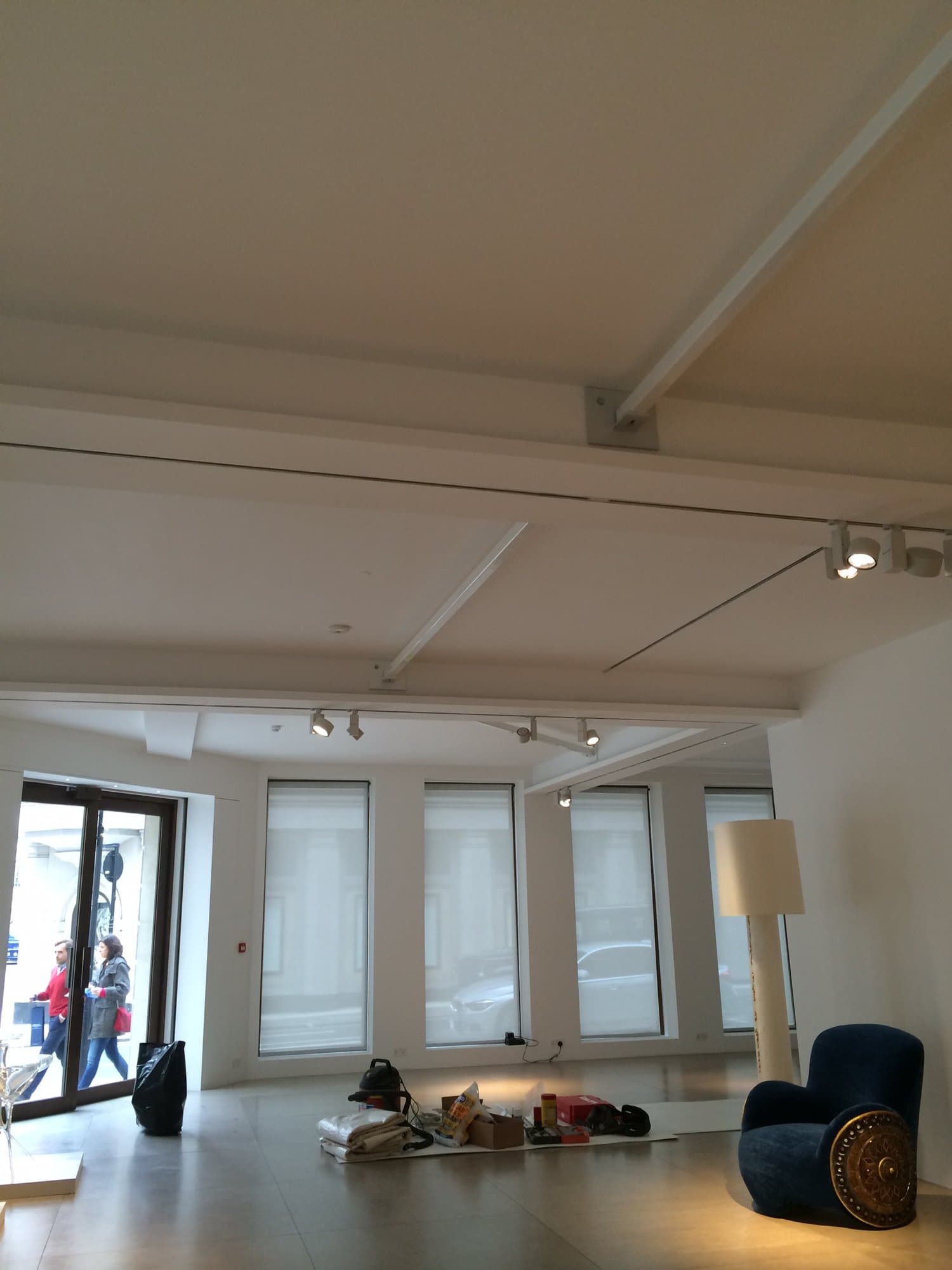 Gallery interior showing the installed ceiling structure and lighting track