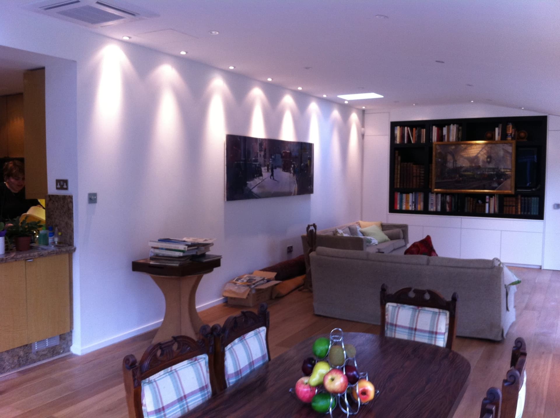 Feature wall lighting and built-in bookshelves inside the extension