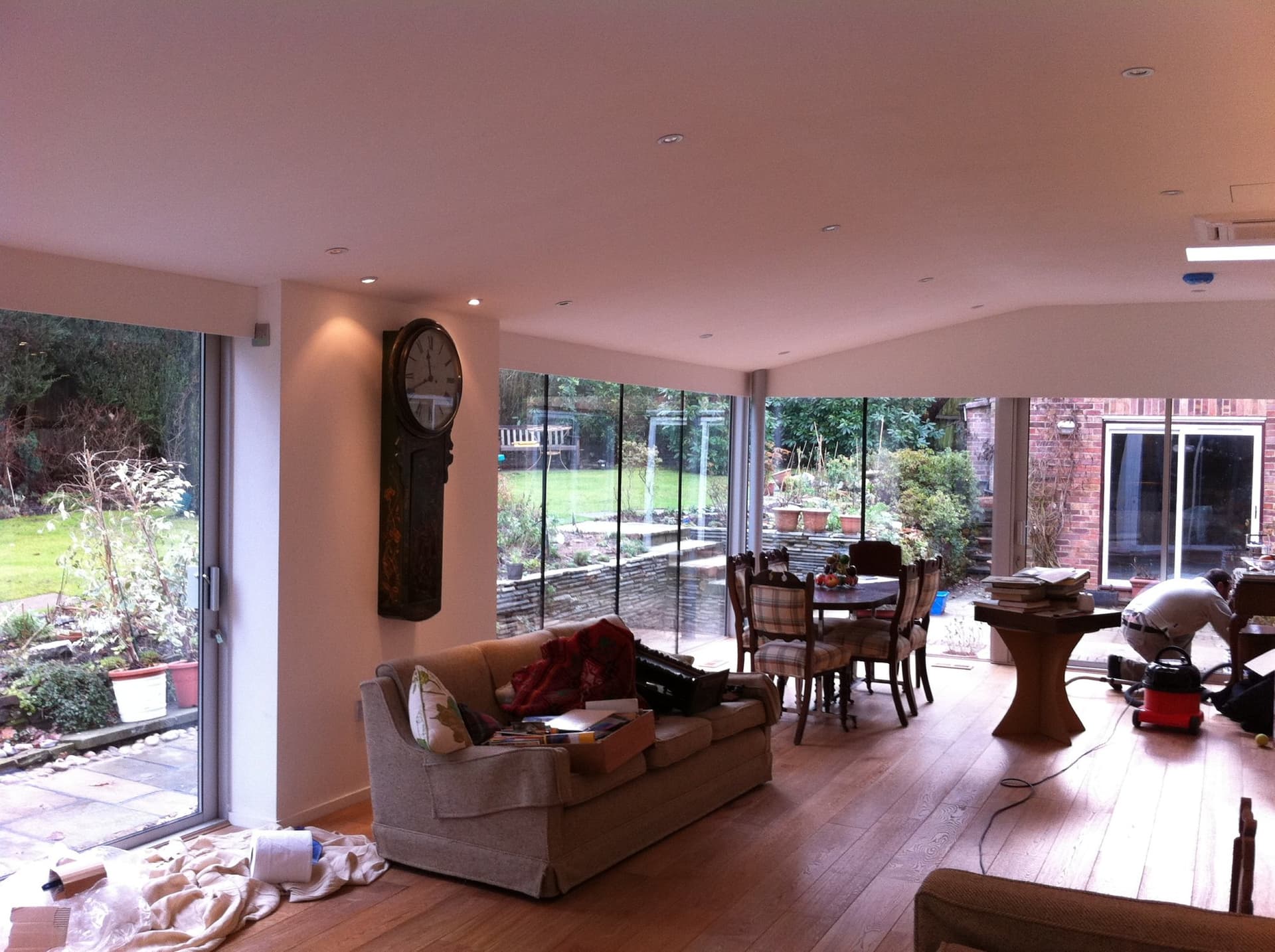 Interior of the extension looking out through full-height glazing to the garden
