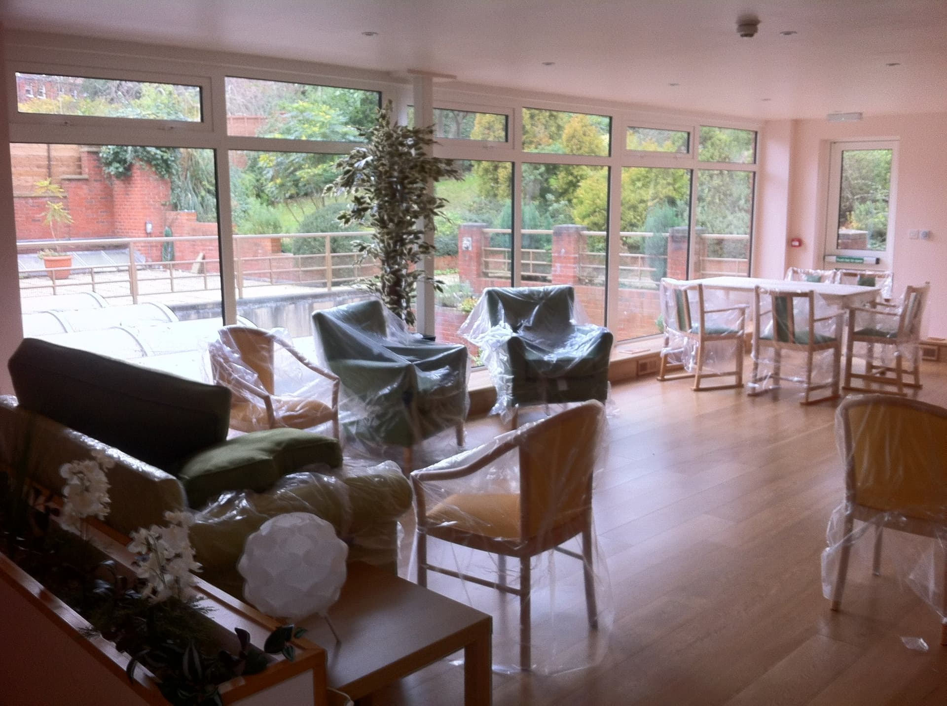 Full-height glazed wall of the extension looking out to the garden terrace