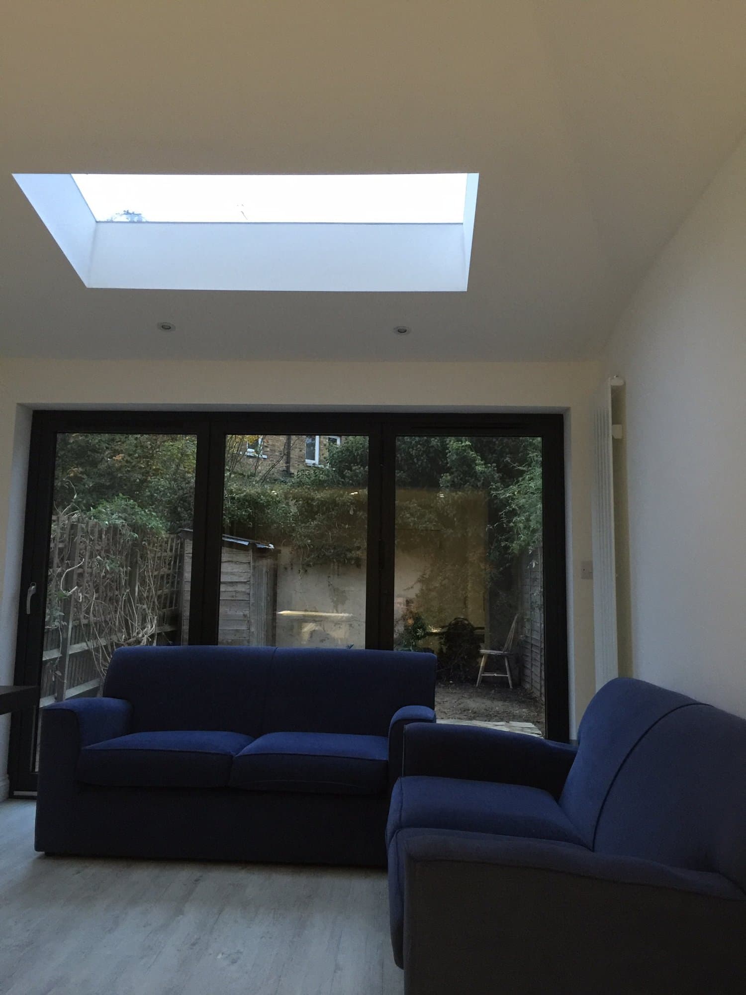 Extension living space with a large rooflight and bifolding doors to the garden