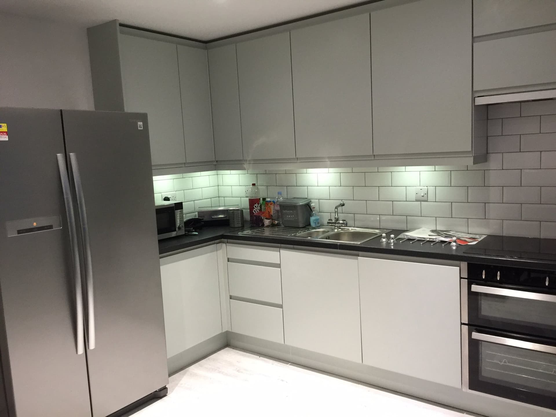 Kitchen worktop, sink and tiled splashback detail