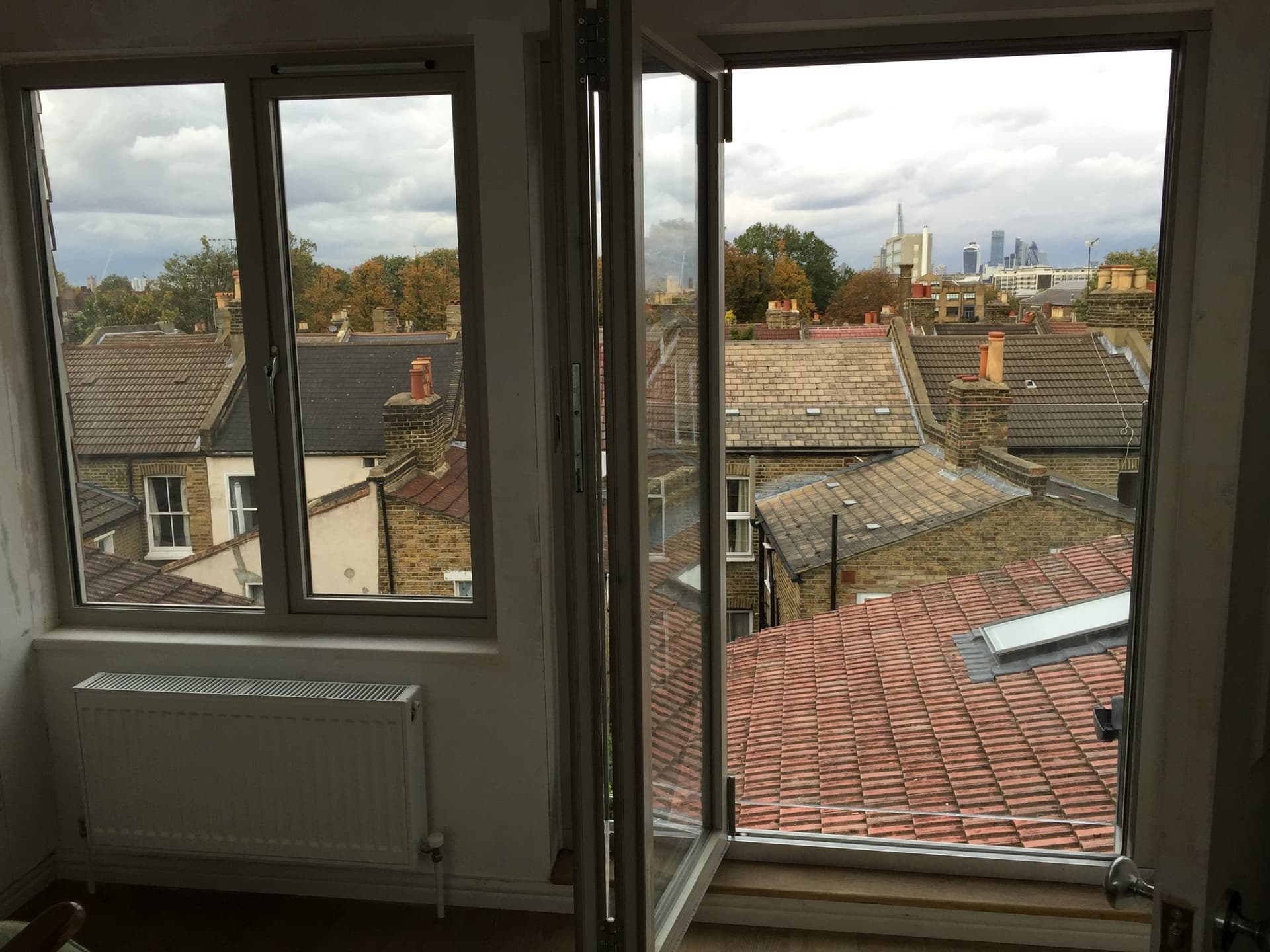 View across London rooftops from the loft conversion, including the Shard