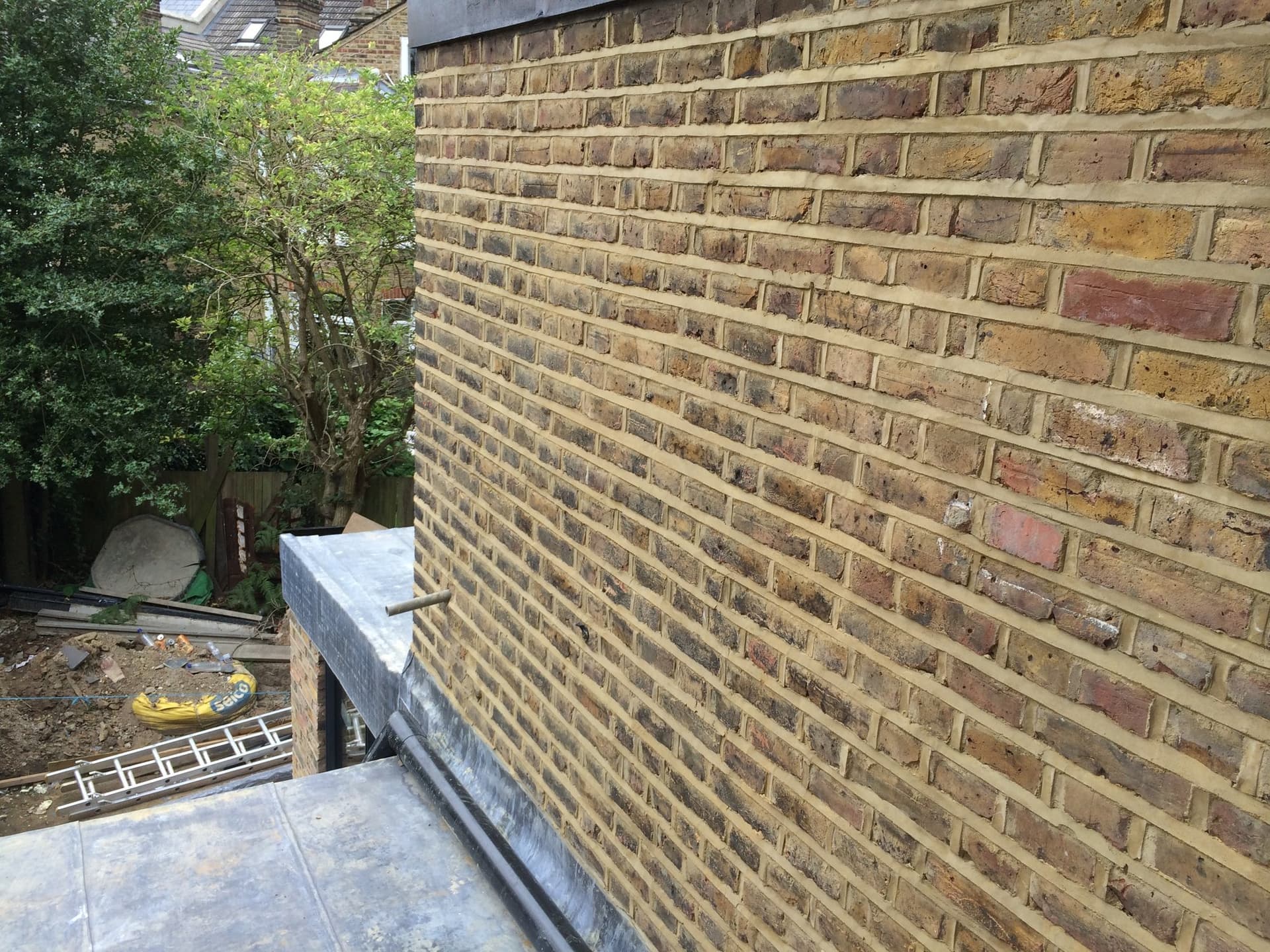 Lead roofing flashing detail against the new brickwork