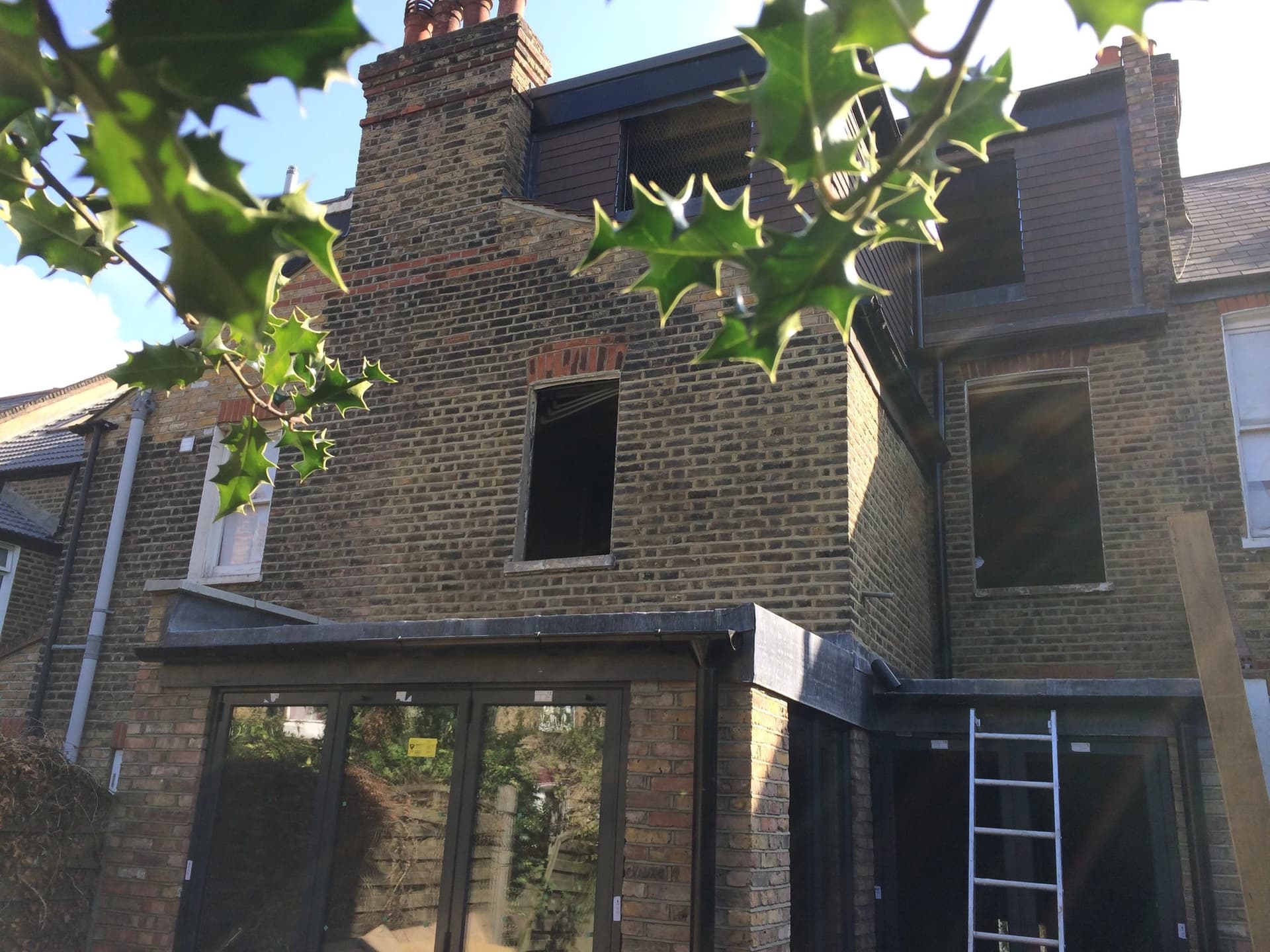 Rear elevation showing the L-shape dormer loft conversion and matched-brick extension