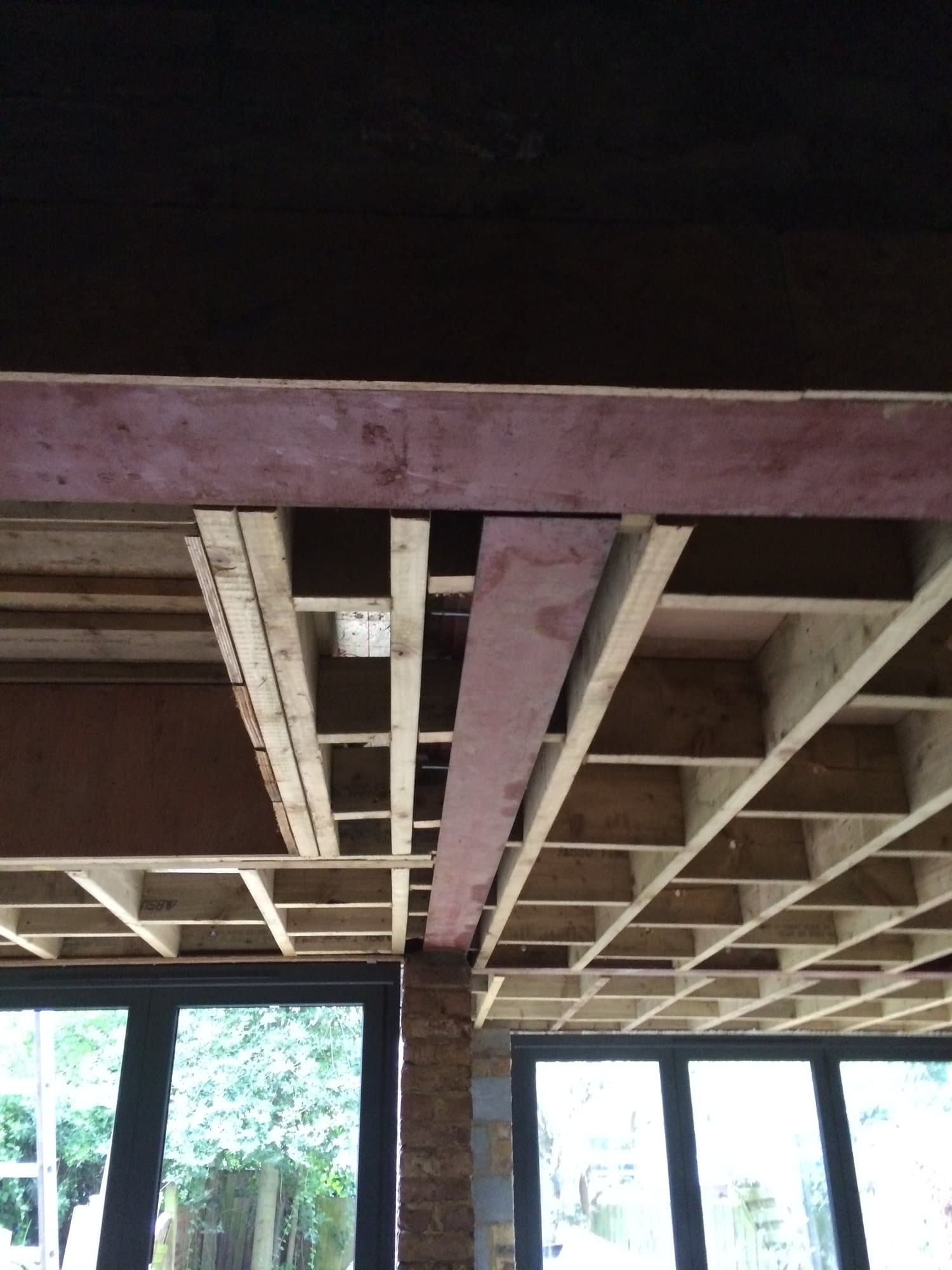 First-fix timber floor joist structure inside the extension