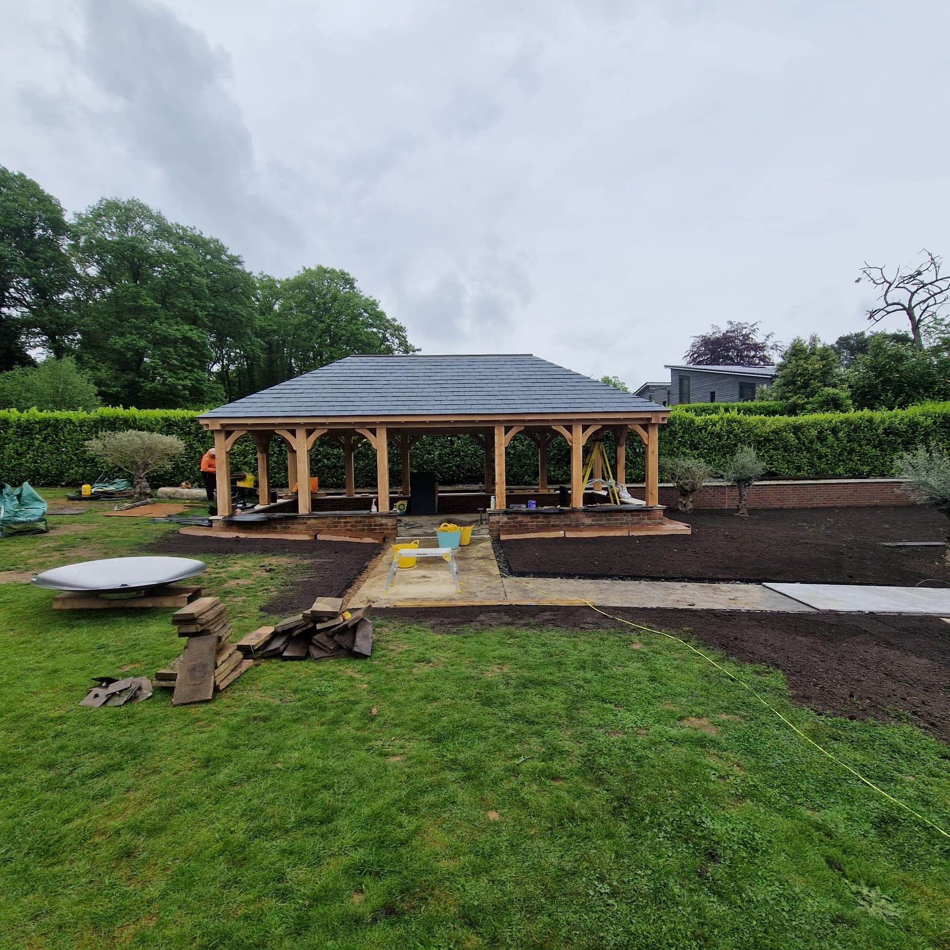 Wide view of the barbecue pavilion and surrounding landscaped garden