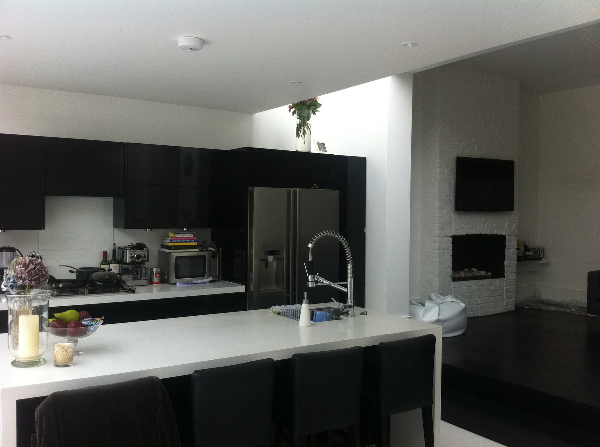 Open-plan kitchen and living space lit by the glazed roof extension