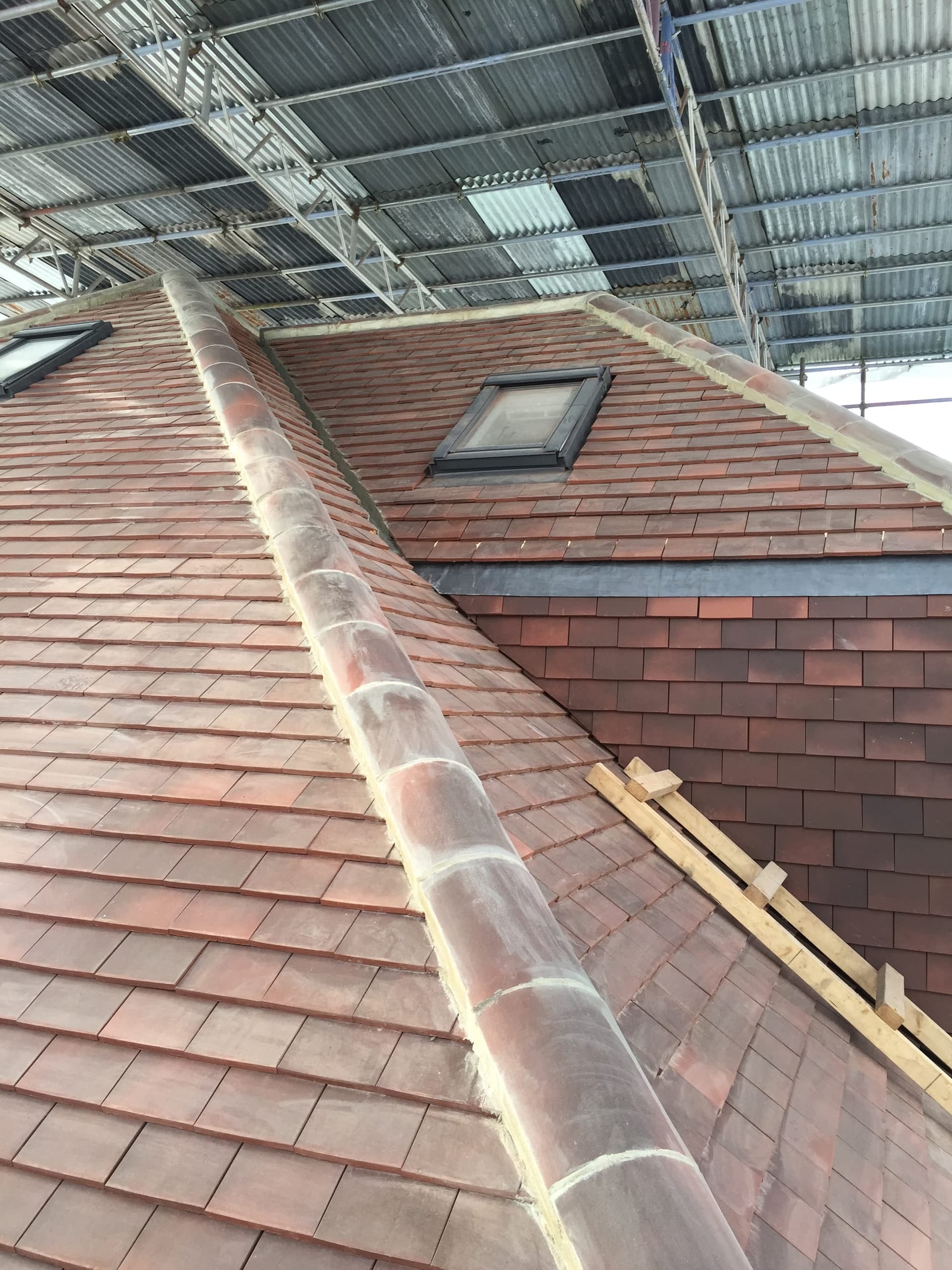 Close-up of the finished hip roof tiling and dormer detail