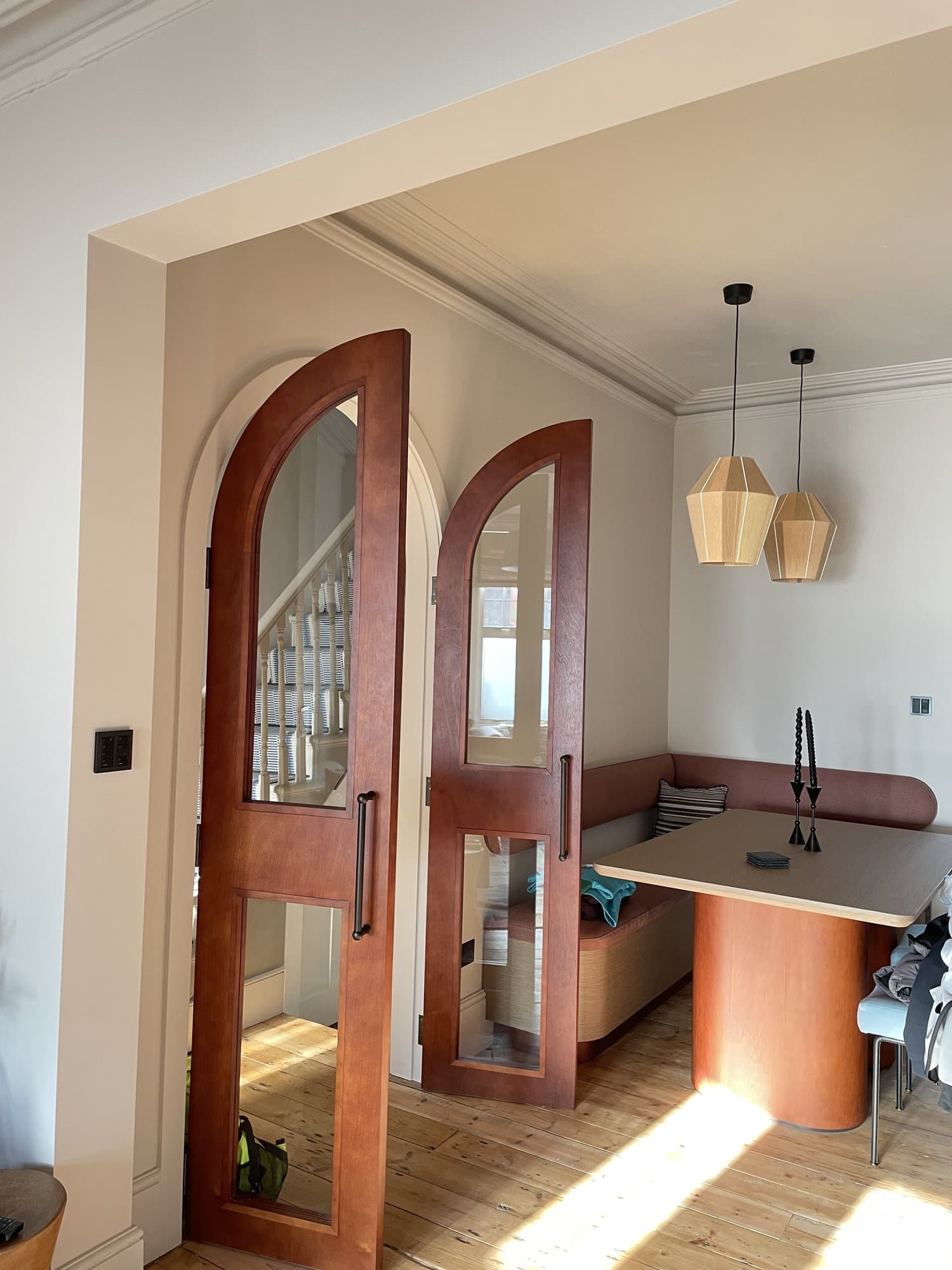 Bespoke curved joinery with reeded glass doors
