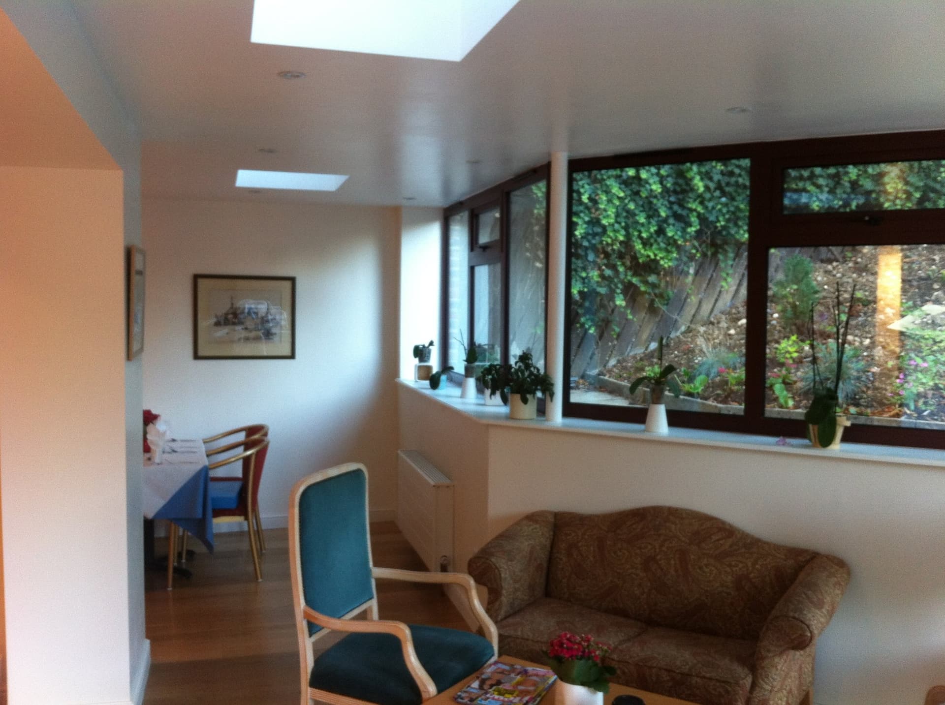 Window bank inside the extension overlooking the terraced garden