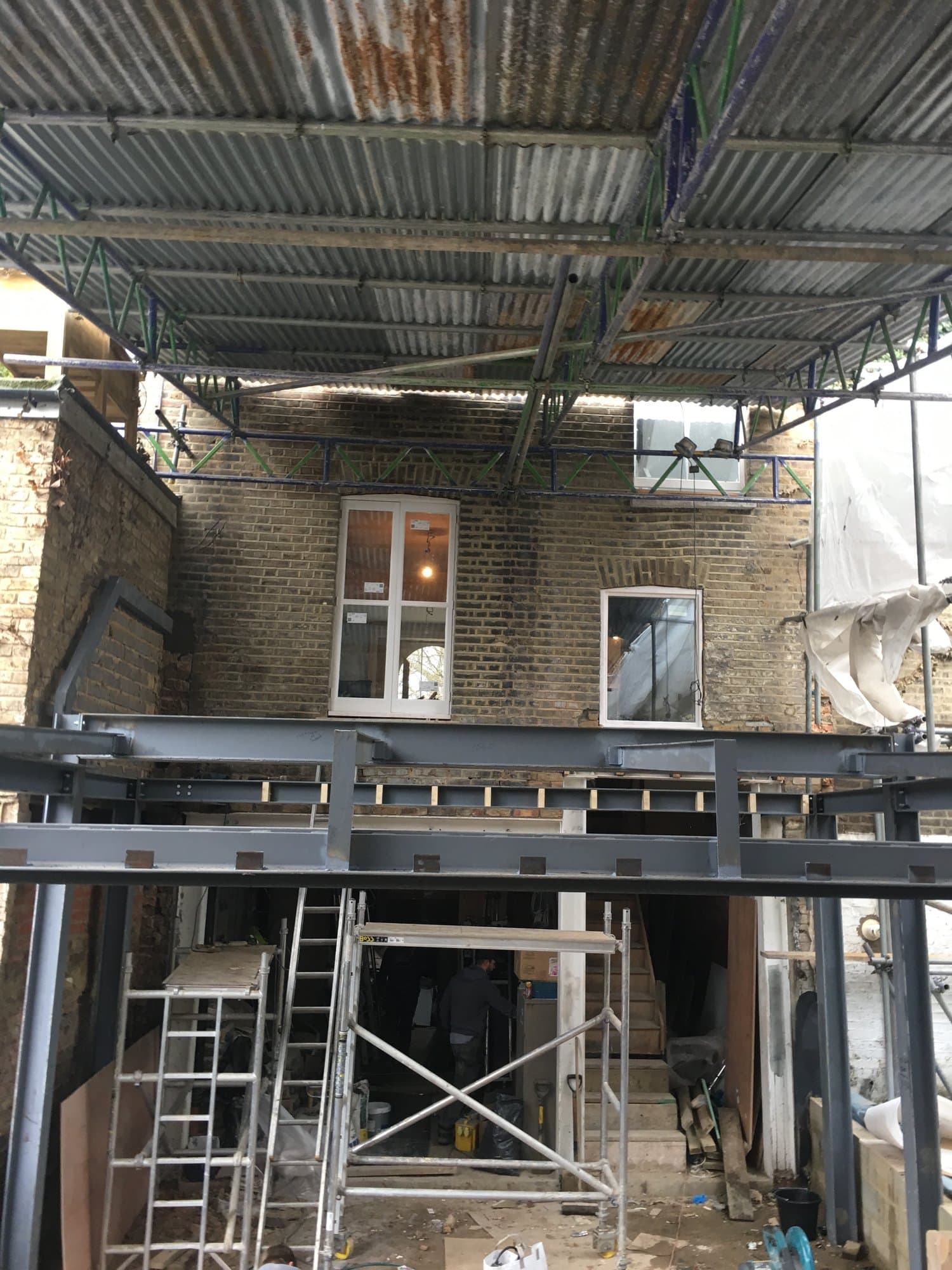 Steel beam and column installed to support the rear wall of a property