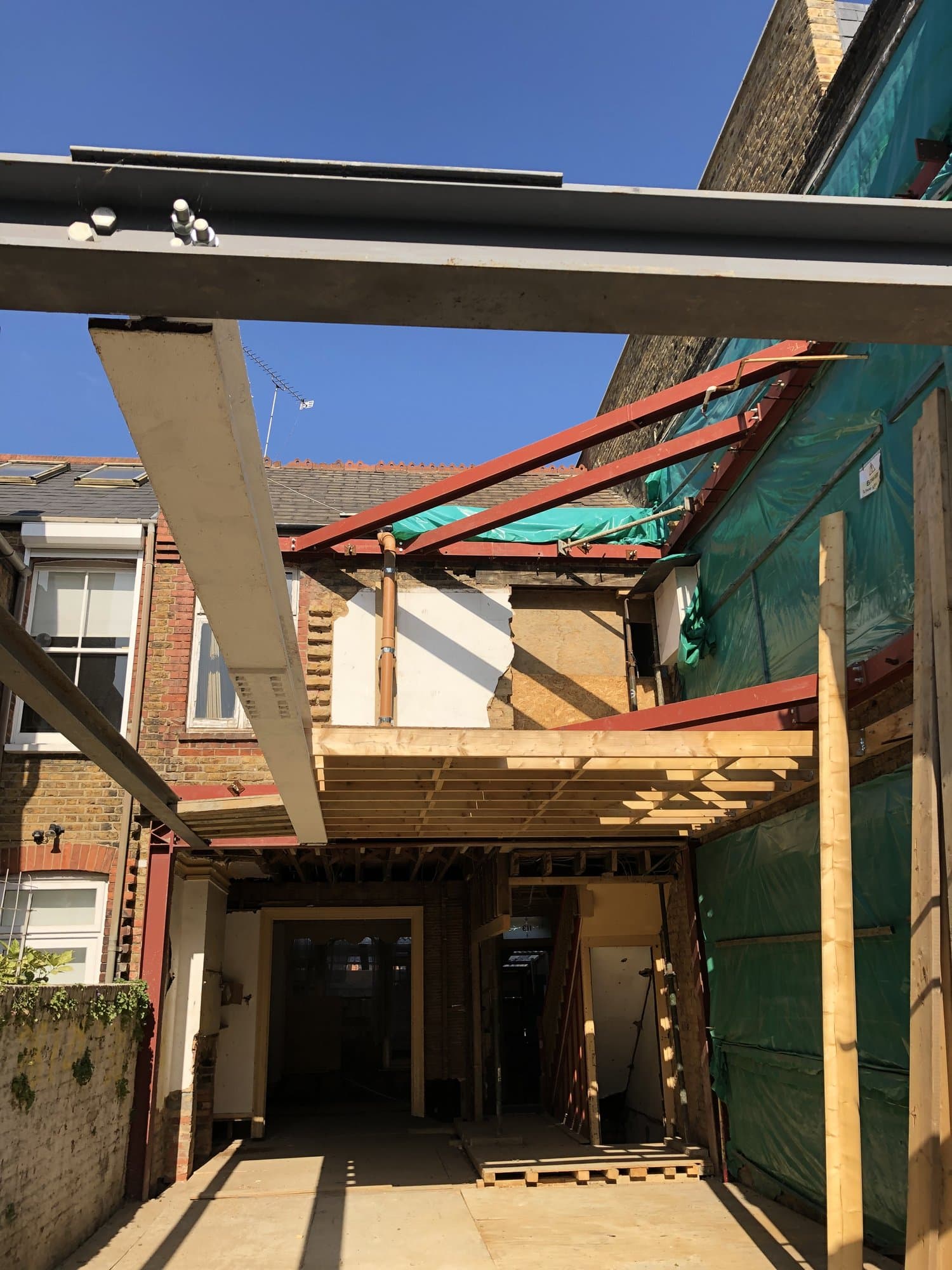 Steel frame tying into new timber floor structure