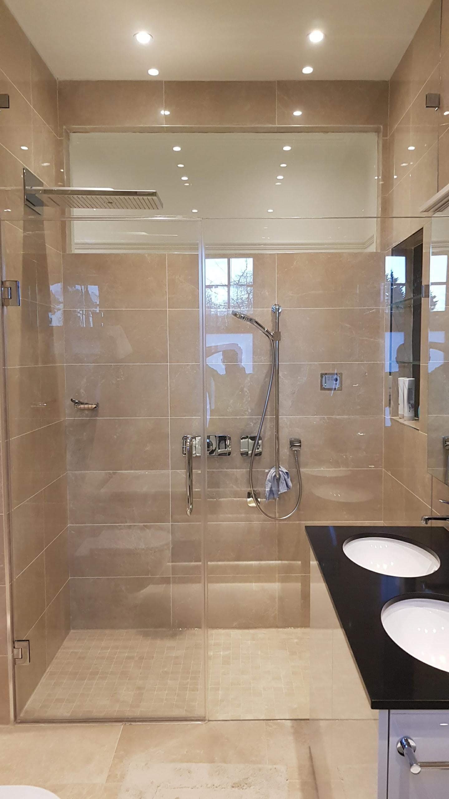 Luxury en-suite bathroom in the new wing with a walk-in shower and double vanity