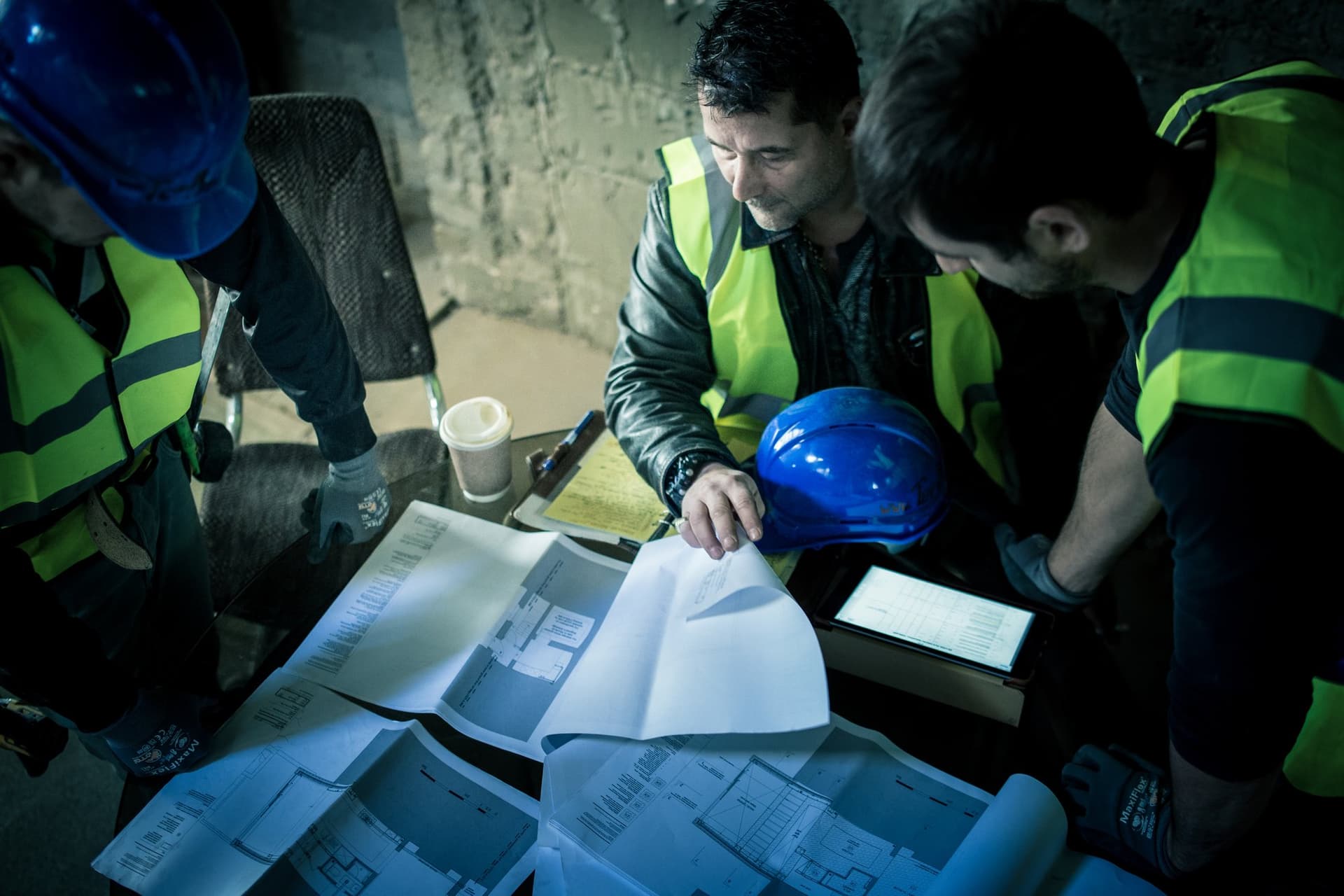 TopBuild UK team members reviewing floor plans and project paperwork
